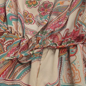 Close-up of bohemian paisley printed fabric with adjustable drawstring waist detail
