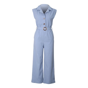 Detail of light blue sleeveless jumpsuit featuring a lapel collar and amber buttons