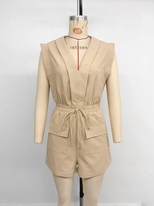 Detail of beige sleeveless V-neck romper with drawstring waist and cargo pockets