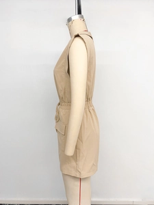 Detail of khaki sleeveless romper showing drawstring waist and cargo side pocket
