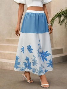 Detailed view of high-waist A-line long skirt with blue floral print and color block design