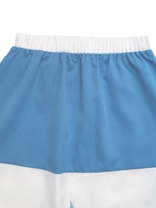 Close-up of elastic waistband and blue-white patchwork fabric on casual A-line skirt