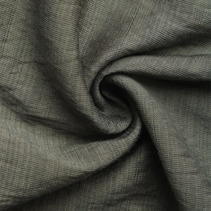 Macro detail of high-quality dark grey linen fabric texture and elegant pleated drape