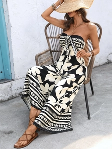 Detail of bohemian black and white print strapless wide-leg jumpsuit with tropical leaf pattern