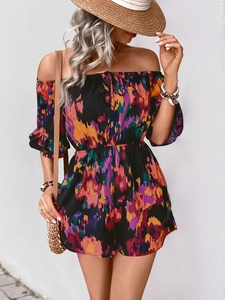 Detail of off-the-shoulder neckline and colorful abstract floral print on summer romper