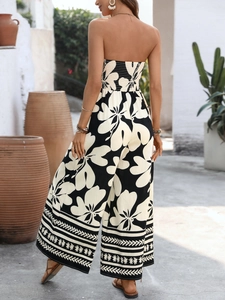 Detail of smocked elastic back on floral strapless wide leg jumpsuit with boho borders