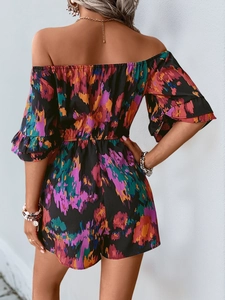 Rear view of off-shoulder floral romper showing elastic waist and ruffled sleeves