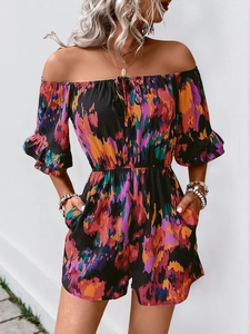 Detail of floral off-shoulder romper with ruffle sleeves and elastic high waist