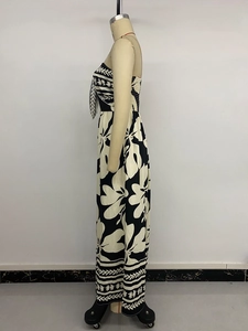 Detail of the black and white floral print and hem patterns on a summer strapless jumpsuit