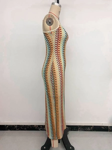 Detail view of Bohemian knitted maxi dress with colorful wave patterns and slim silhouette