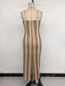 Macro shot of colorful wave pattern knit texture and strap detail on a slim dress