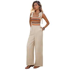 Ethnic print sleeveless wide leg jumpsuit with tie shoulder straps and geometric pattern