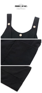 Detail of black overall jumpsuit featuring wooden buttons and precise pocket stitching
