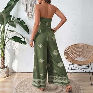 Green strapless wide leg jumpsuit with white floral print and backless vacation style