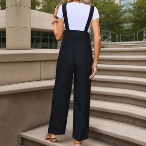 Women's minimalist black wide-leg overalls paired with a basic white t-shirt