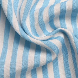 Macro shot of light blue and white striped woven fabric showing texture and soft drape