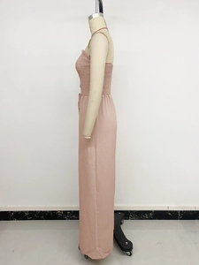 Detail of dusty rose smocked tube top jumpsuit with high waist wide leg cut