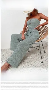 Detail of green floral tube top jumpsuit with wooden buttons and waist tie design