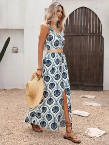 Detail of bohemian V-neck maxi dress with mandala print, belt and side slit