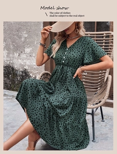 Detail of V-neck leopard print dress featuring a drawstring waist and ruffled hemline