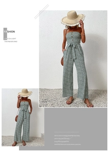 Close-up of strapless floral jumpsuit featuring front buttons and self-tie waist detail