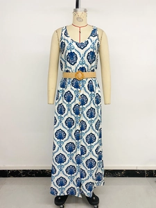 Detail of V-neck sleeveless maxi dress with blue ethnic print and woven straw belt