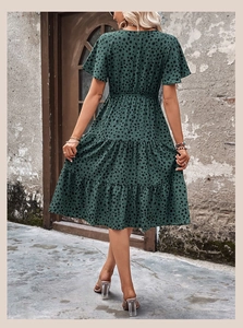Detail of deep green leopard print midi dress with tiered ruffle skirt and high waist