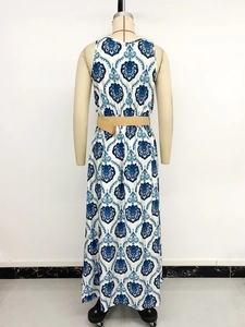Back view of bohemian white maxi dress with blue floral print and woven waist belt