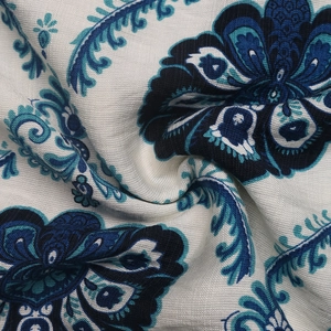 Close-up of ethnic floral print fabric with vintage patterns and cotton-linen texture
