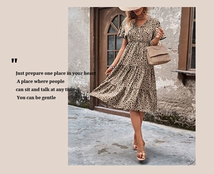 Detail of V-neck leopard print dress featuring tiered skirt and drawstring waist