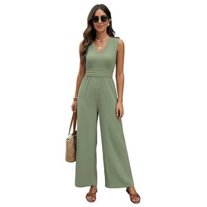 Sage green sleeveless V-neck wide leg jumpsuit with smocked waist and textured fabric