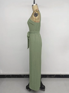 Detail of sage green waffle fabric jumpsuit with waist tie and strapless folded neckline