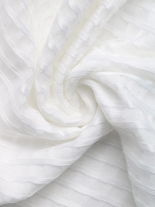 Close-up of white mesh knit fabric with textured horizontal stripes and soft mesh detail