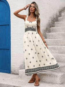 Close-up of the V-neck pleated chest and wide waist detail on a bohemian printed dress