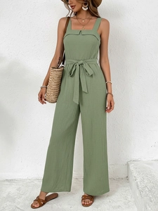 Sage green linen jumpsuit with waist tie and wide leg design for summer vacation look