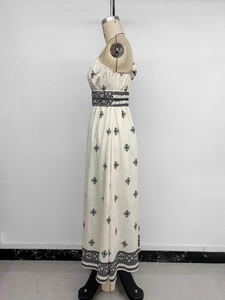 Detailed side view of ethnic floral printed sundress featuring geometric patterns and high waist