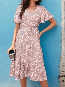 Detail of V-neck ruffled polka dot midi dress with adjustable drawstring waist tie