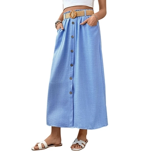 Light blue A-line midi skirt with brown buttons, elastic waist, and woven straw belt