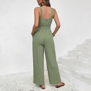 Grass green sleeveless wide leg jumpsuit with textured fabric and tie-waist belt design