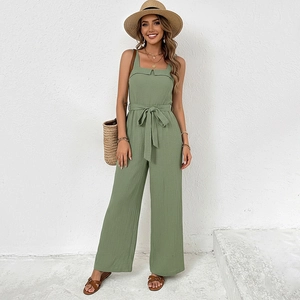 Grass green sleeveless linen jumpsuit with a square neck and waist tie for summer wear