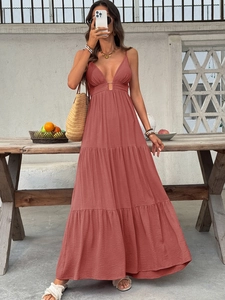 Brick red deep V-neck tiered maxi dress with bohemian accessories for summer beach vacation