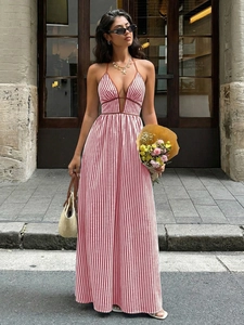 Detail of red and white vertical striped maxi dress with halter v-neck and backless design