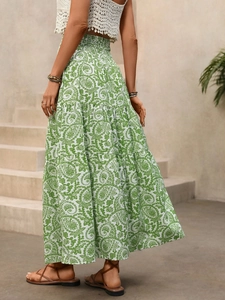 Detail view of high-waisted paisley print maxi skirt with layered ruffle hem and elastic waist