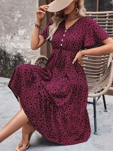Detailed view of burgundy polka dot midi dress with V-neck, ruffle sleeves and drawstring waist
