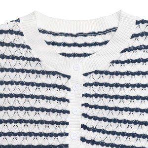 Detail of navy stripe knit T-shirt showing ripple texture and white button closure