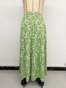 Detail view of paisley print maxi skirt with tiered layers and elastic tassel waist