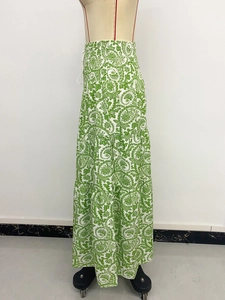 Detailed view of bohemian green paisley print tiered maxi skirt with elastic high waist
