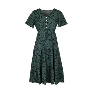 Detail of green leopard print V-neck dress with white buttons and tiered skirt layers