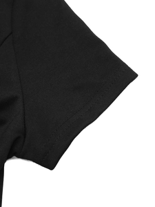 Detailed view of the double stitching on the sleeve of a black casual short sleeve T-shirt dress