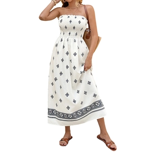 Bohemian white smocked maxi dress with blue floral print and strapless neckline